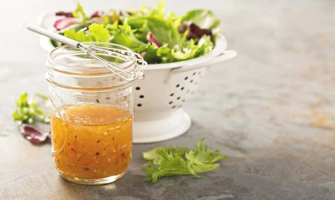 hhc salad dressing in jar with salad